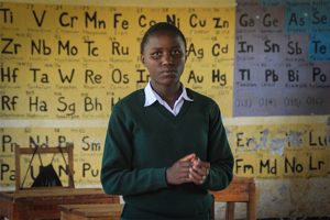 Girl From African School In Classroom