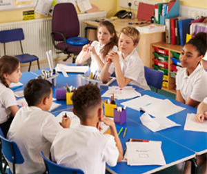 School Children Working At A Table