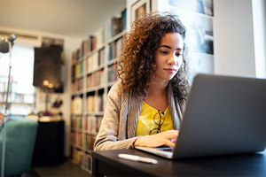 Girl Working On Laptop