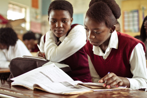 African Girls Working Together On Their Studies