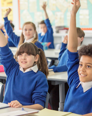 School Children With Hands Up